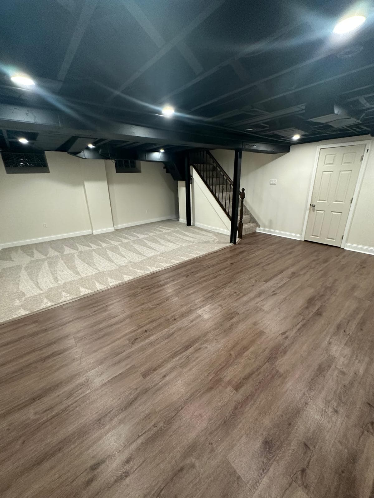 Basement carpet and vinyl flooring combo installation in Downriver Michigan home