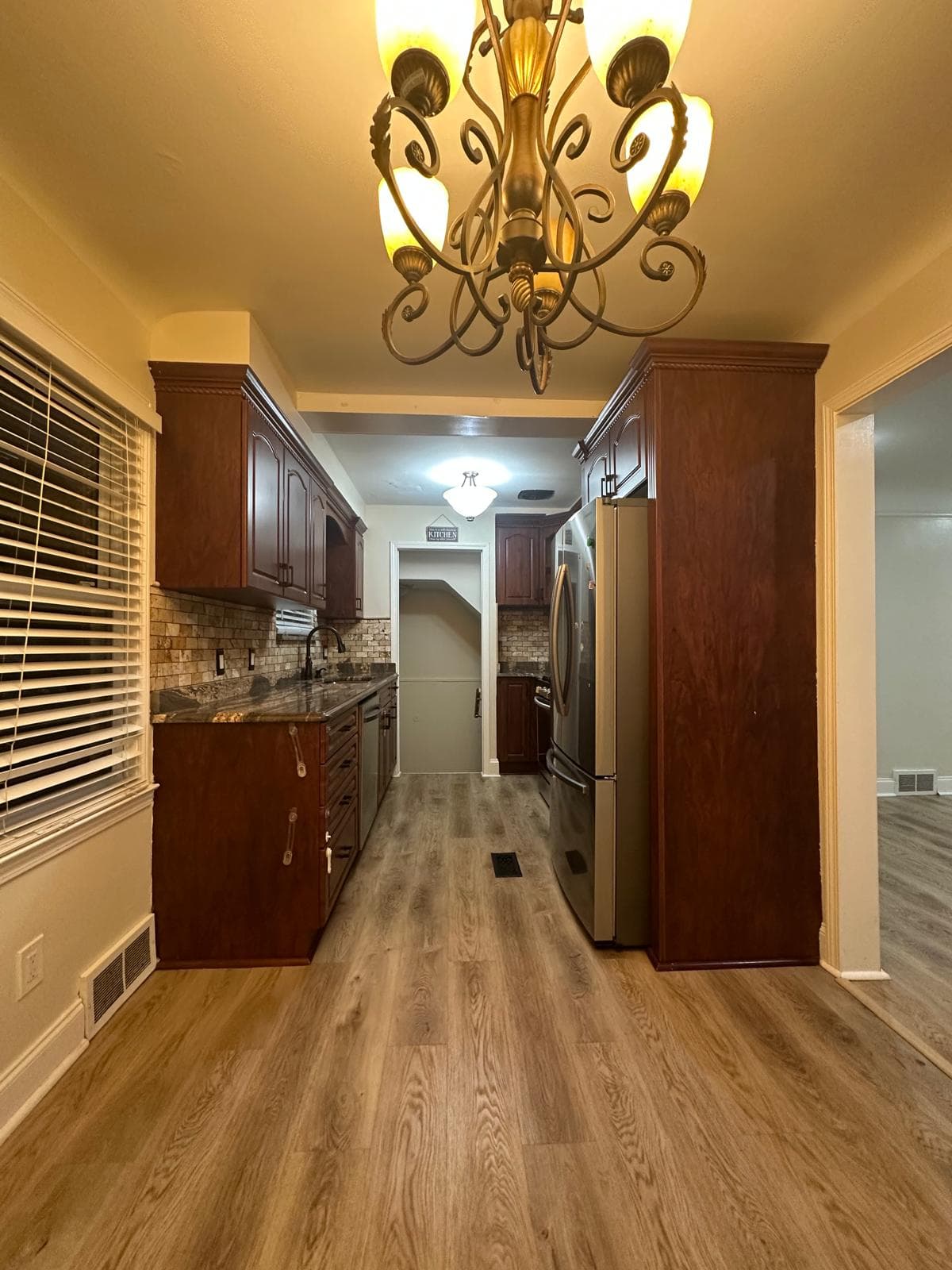 Kitchen luxury vinyl plank flooring installation in Metro Detroit home by Paradise Floors