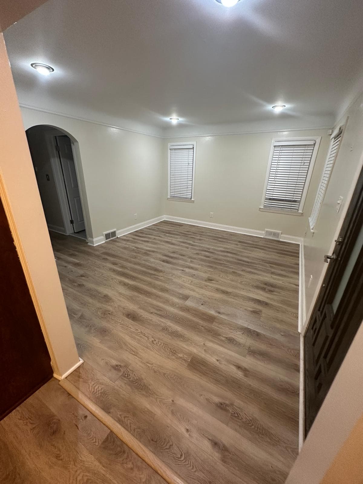 Living room vinyl plank flooring installed in Southeast Michigan residence by Paradise Floors